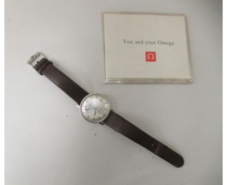 An Omega Seamaster De Ville wristwatch, faced by a baton dial and a subsidiary and date aperture with an certificate of authe