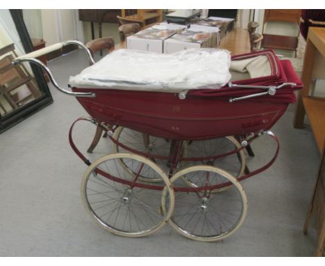 A Silver Cross, Balmoral, coach-built pram in maroon livery with an unused Silver Cross white embroidery anglaise sun-canopy 