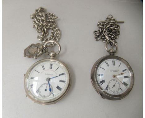 A silver cased pocket watch with engine turned decoration, the keyless movement faced by a Roman dial and a subsidiary; and a