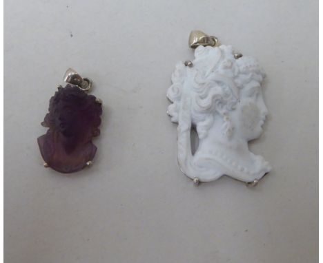 Two dissimilar silver mounted cameo pendants 