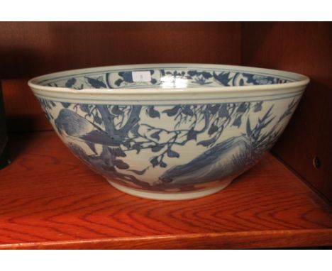 A 20thC Chinese porcelain bowl, decorated with flora and butterflies&nbsp; 14.5"dia 