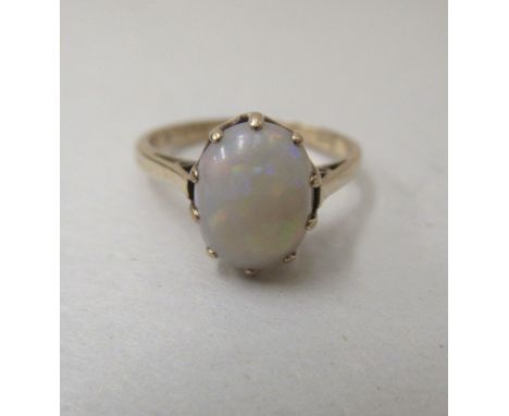 A 9ct gold ring, set with a cabochon cut opal&nbsp; 