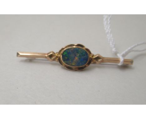 A 9ct gold bar brooch, set with an opal&nbsp; 