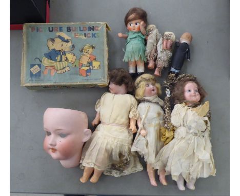 Mixed juvenilia: to include four vintage porcelain head dolls&nbsp; largest 10"h 
