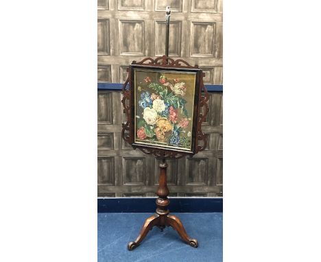 VICTORIAN MAHOGANY POLE FIRESCREEN, the screen inset floral embroidered panel, within a fretted border, on three scroll feet,