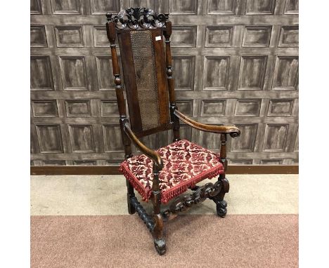 19TH CENTURY OPEN ELBOW CHAIR, with scroll and foliate engraved top rail above turned supports, caned back and seat with asso