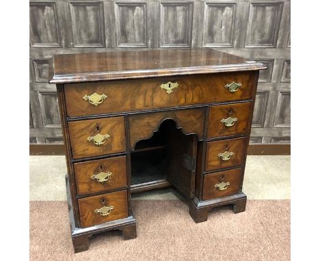 QUEEN ANNE WALNUT KNEEHOLE WRITING DESK, the long frieze drawer with shaped brass swing handles and escutcheon, each pedestal