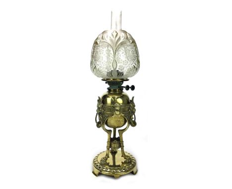 VICTORIAN BRASS OIL LAMP, with clear glass chimney, the baluster glass shade engraved with scrolling foliage, interspersed wi