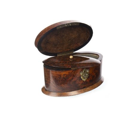 VICTORIAN FIGURED WALNUT TEA CADDY, of lozenge form, the hinged cover opening to reveal a single lidded compartment, shaped b