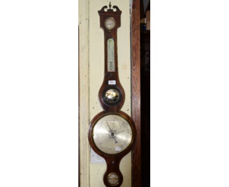 A 19th century mahogany wheel barometer, with thermometer, hydrometer and level, Mangiacavalli, London, in a mahogany wheel c