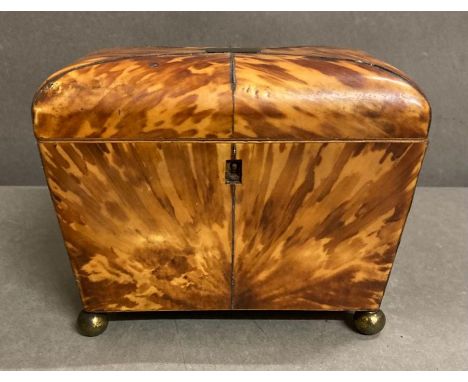 An antique tortoiseshell  tea caddy on brass ball feet AF