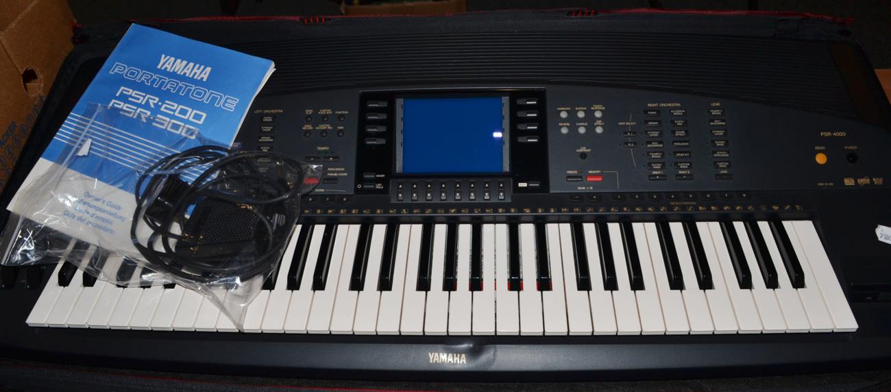 A Yamaha PSR 4000 Electronic Keyboard, foot pedal and lead, with soft case