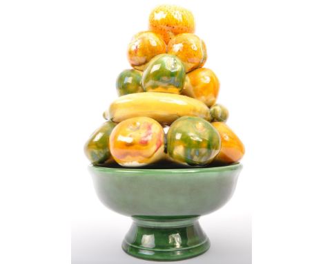 A vintage 20th century Continental Portuguese ceramic pottery decorative centrepiece fruit bowl with various fruits to top. I