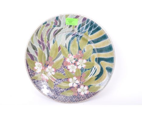 Desmond Clover - A vintage 20th century studio pottery charger plate having hand painted florals and lattice work to surface.