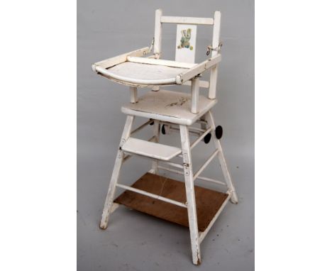 A vintage white painted folding children's high chair