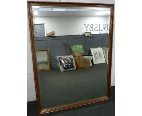 A large bevelled mirror in gilt and maroon frame, 150x117cm