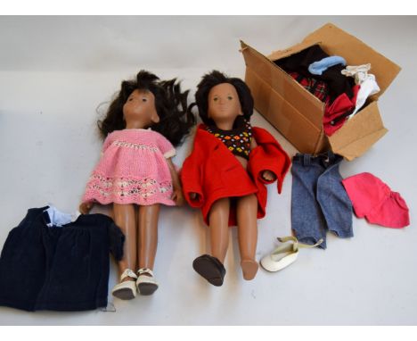 Two Sasha dolls the first with brown eyes and the second with green eyes together with associated clothing and a rag doll in 