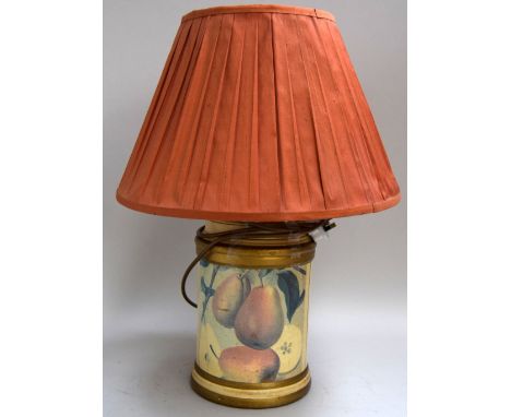 A table lamp with a fruit design with an apricot fabric shade