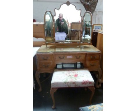 A burr walnut veneer dressing table of two drawers either side of a dressing mirror over two drawers on cabriole legs with fo