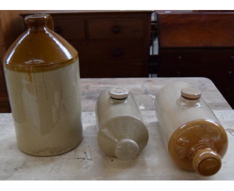 An earthenware cider jug together with two ceramic bed warmers
