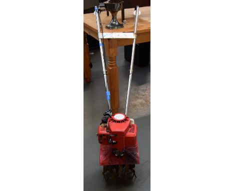 A Mantis 2-stroke petrol engine rotivator