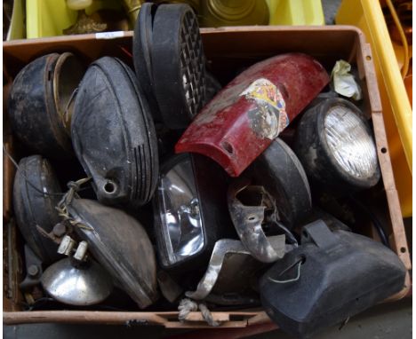 A large selection of automobile parts mostly headlights