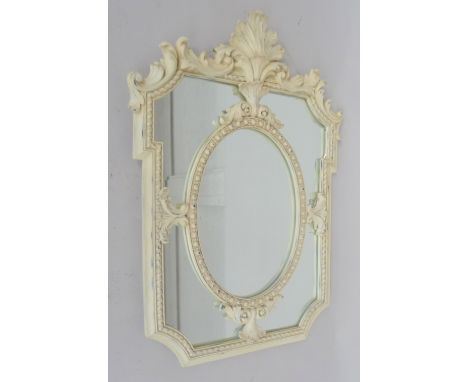 A Louis XVI style painted wood mirror with the oval plate surrounded by subsidiary plates, 90cmHx60cm