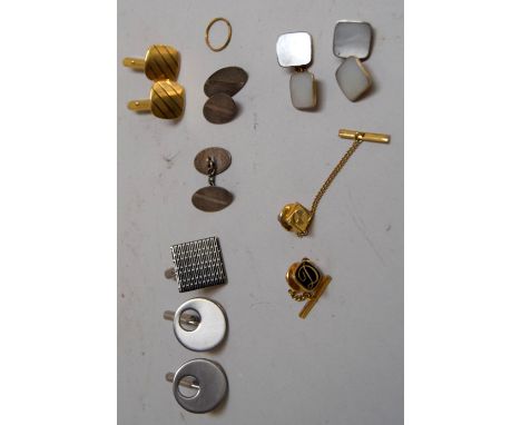 A selection of gents cufflinks including a pair marked silver and a mother of pearl pair amongst others
