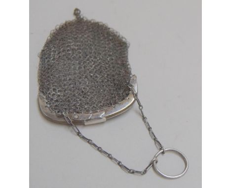 A small ladies chain mail coin purse with clasp closure on small chain