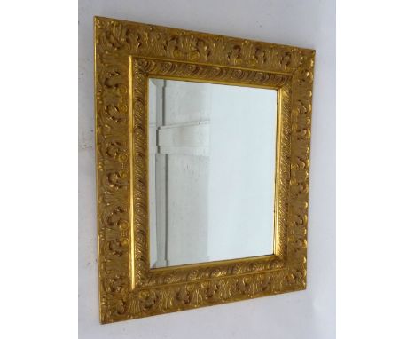 A Louis 14th style gilt mirror with bevelled glass and foliate moulded frame, 75cmHx65cm