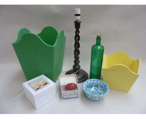 A spindle turned lamp together with two painted paper bins, a ceramic luna votive and a Portuguese olive dish