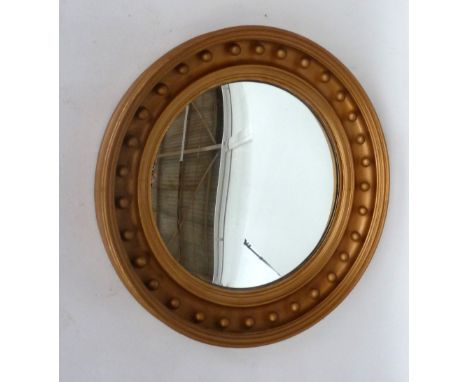A Regency style gilt convex mirror 71cmD