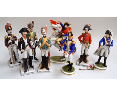 A large selection of ceramic polychrome continental German figurines mostly of soldiers from the Napoleonic era including a c