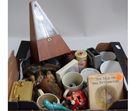 A mixed lot to include a carriage clock, several commemorative ware mugs and a metronome amongst other items