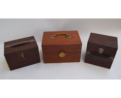 Two vintage hardboard 8mm can holders, one with 12 slots, measuring  21 x 14 x 14cmH; one with six adjustable slots, measurin
