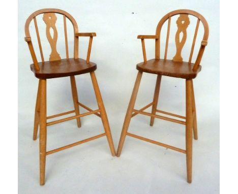A pair of midcentury Ercol style children's high chair with pierced splat baluster backs