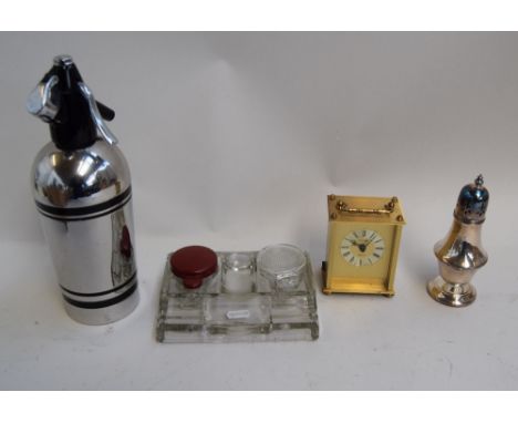 A mixed lot including a glass inkwell with two wells, a stainless vintage soda syphon, a carriage clock by Estyma, and an EPN