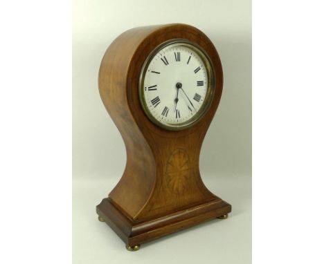 An Edwardian mahogany mantel clock, circa 1910, the movement with a lever escapement and circular white enamel dial in a fan 