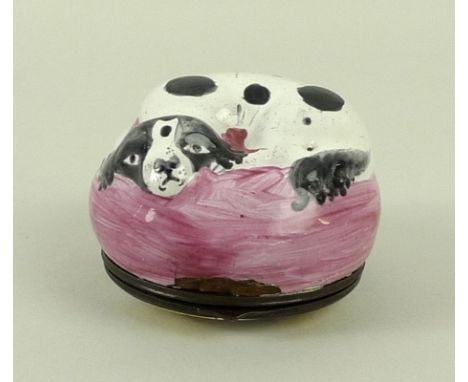 A Bilston or South Staffordshire enamel pill box/bonboniere with hinged metal mounts, late 18th century, modelled as a recumb