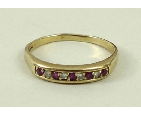 A 9ct gold, ruby and diamond ring, set with five rubies divided by four diamonds, size S, 2.2g. 