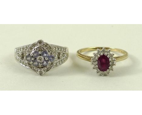 A 15ct gold, ruby and diamond ring, the central oval cut ruby surrounded by fourteen diamonds, size O, 2.4g, and a 9ct gold d