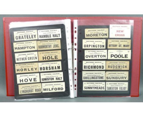 A large collection of vintage luggage labels including London and South Western Railway, GWR, Southern Railway and LMS.