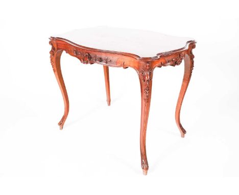 A French Louis XV Style walnut cartouch topped centre table with shell and scroll carved underframe. On slender cabriole legs