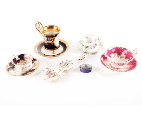 A 19th century Meissen porcelain cabinet cup and saucer, decorated with hand-painted flowers and insects nd further applied f