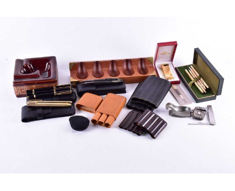A cased Waterman "Rhapsody" Le Man black and gold plated three pen and pencil set including propelling pencil cartridge fount
