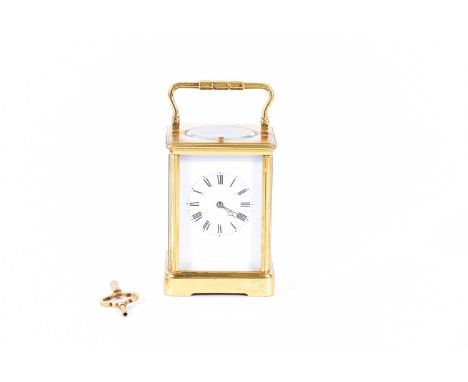 An early 20th century 8-day repeating carriage clock. With gilt brass corniche case. The movement with a surety roller mechan