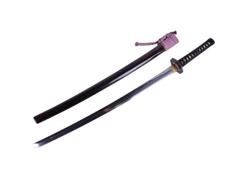 A Japanese Katana and scabbard, Showa period. The blade with midare hamon, the tang marked for Ido Hidetoshi of Seki, Mino pr