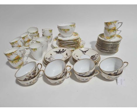 A late 19th century Pirkenhammer eight place part tea set, decorated with birds, insects and blossoming flowers, heightened w