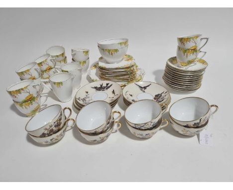 A late 19th century Pirkenhammer eight place part tea set, decorated with birds, insects and blossoming flowers, heightened w