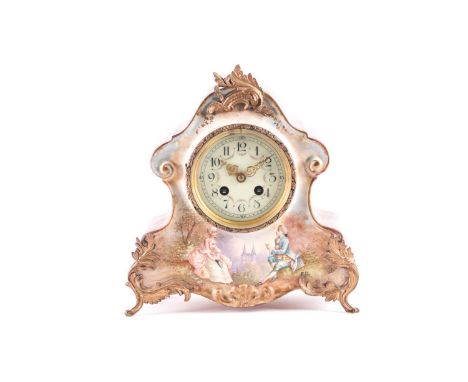 A French early 20th century 8-day porcelain cased mantle clock. The simple movement chiming the hours on a coil gong. The cas